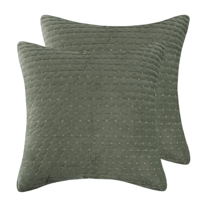 Two square quilted throw pillows in a muted sage green color, featuring a subtle stitched geometric pattern, shown against a plain white background.
