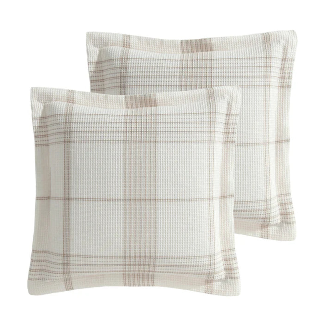 Two square throw pillows with a textured waffle-weave fabric and a beige plaid pattern, shown on a plain white background.