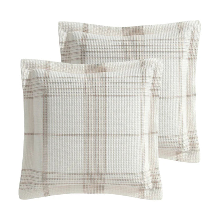 Two square throw pillows with a textured waffle-weave fabric and a beige plaid pattern, shown on a plain white background.