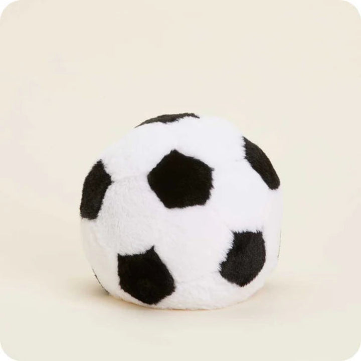 Plush soccer ball toy on a beige background