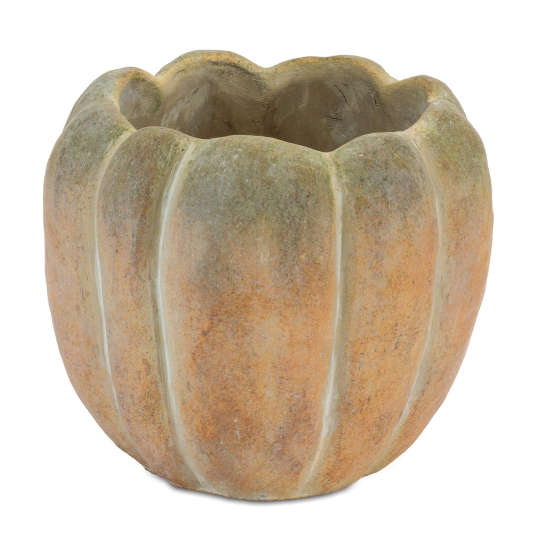 Decorative stone pumpkin planter on a white background