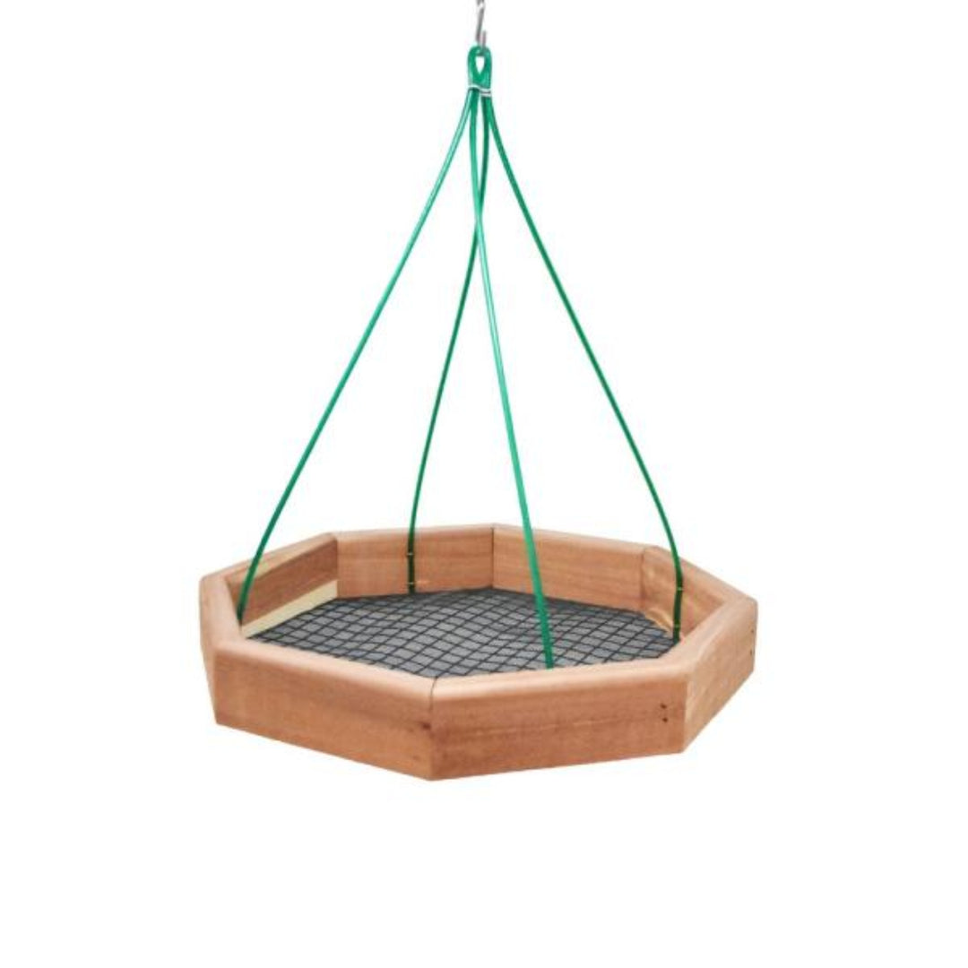Hexagonal wooden bird feeder with green hanging straps on a white background