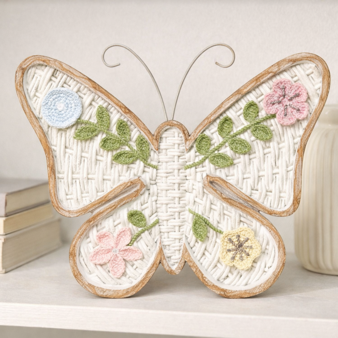 Decorative butterfly wall art with floral elements on a white surface