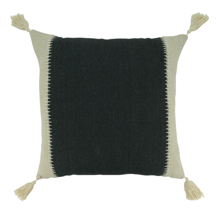 Black pillow with beige edges and tassels on a white background