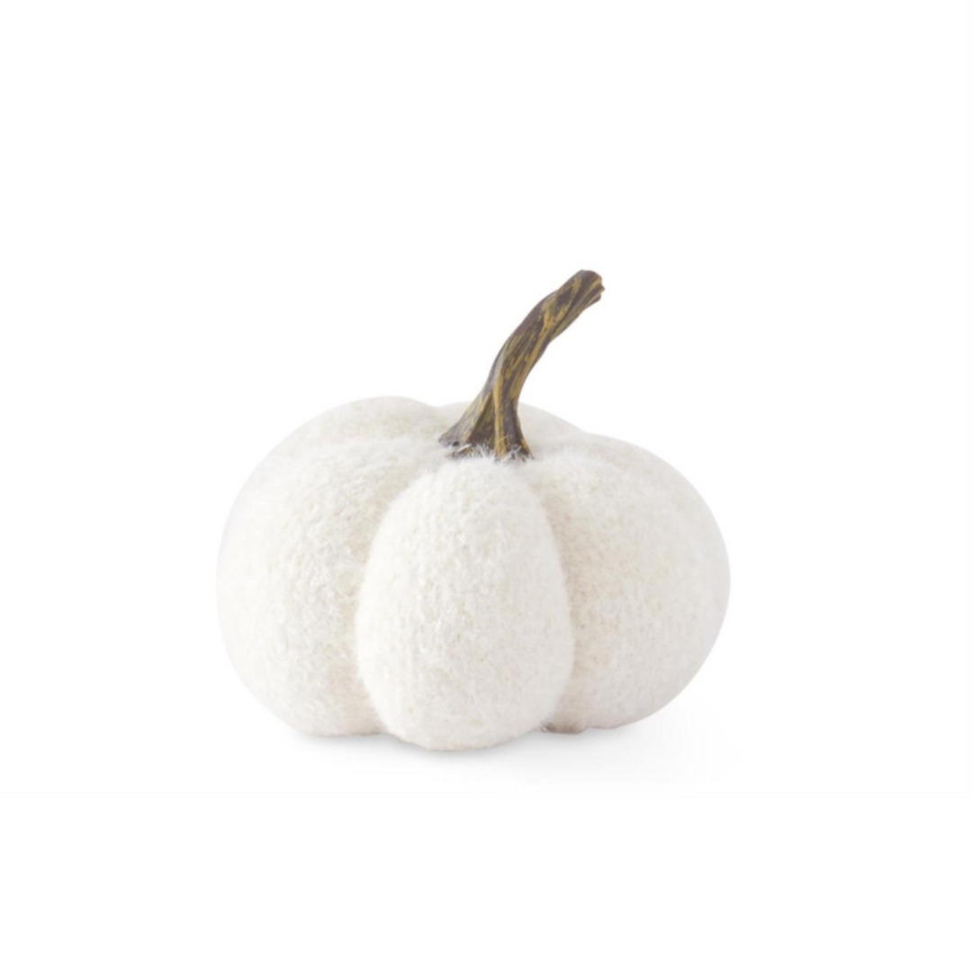 A small decorative faux pumpkin in a soft off-white felt or plush fabric, with a short brown stem, isolated on a white background.