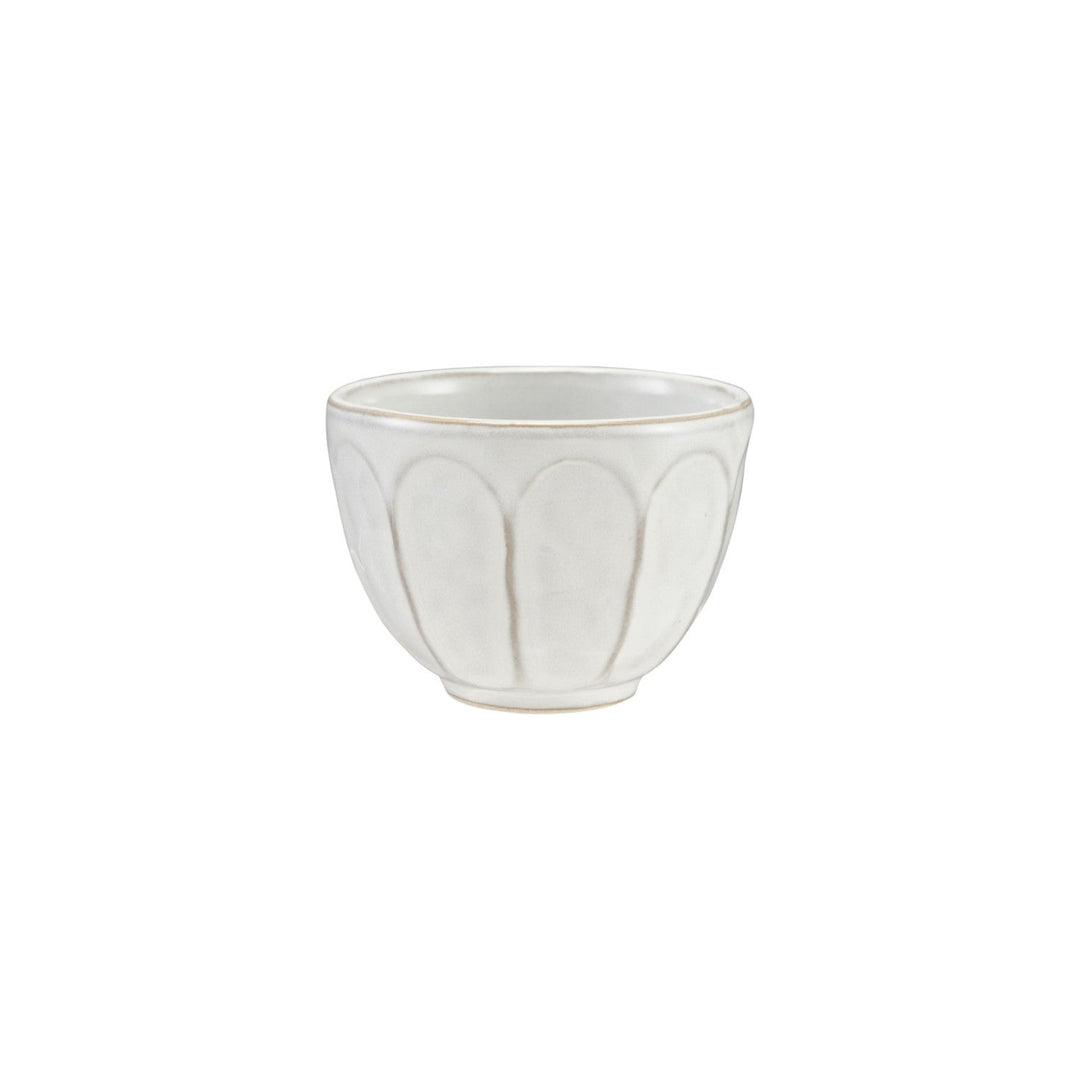 White ceramic bowl with decorative pattern on a white background