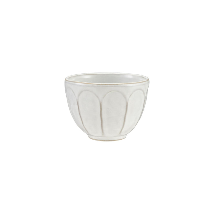 White ceramic bowl with decorative pattern on a white background