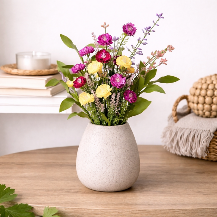 Wild Bachelor Button Bouquet in vase on wooden coffee table