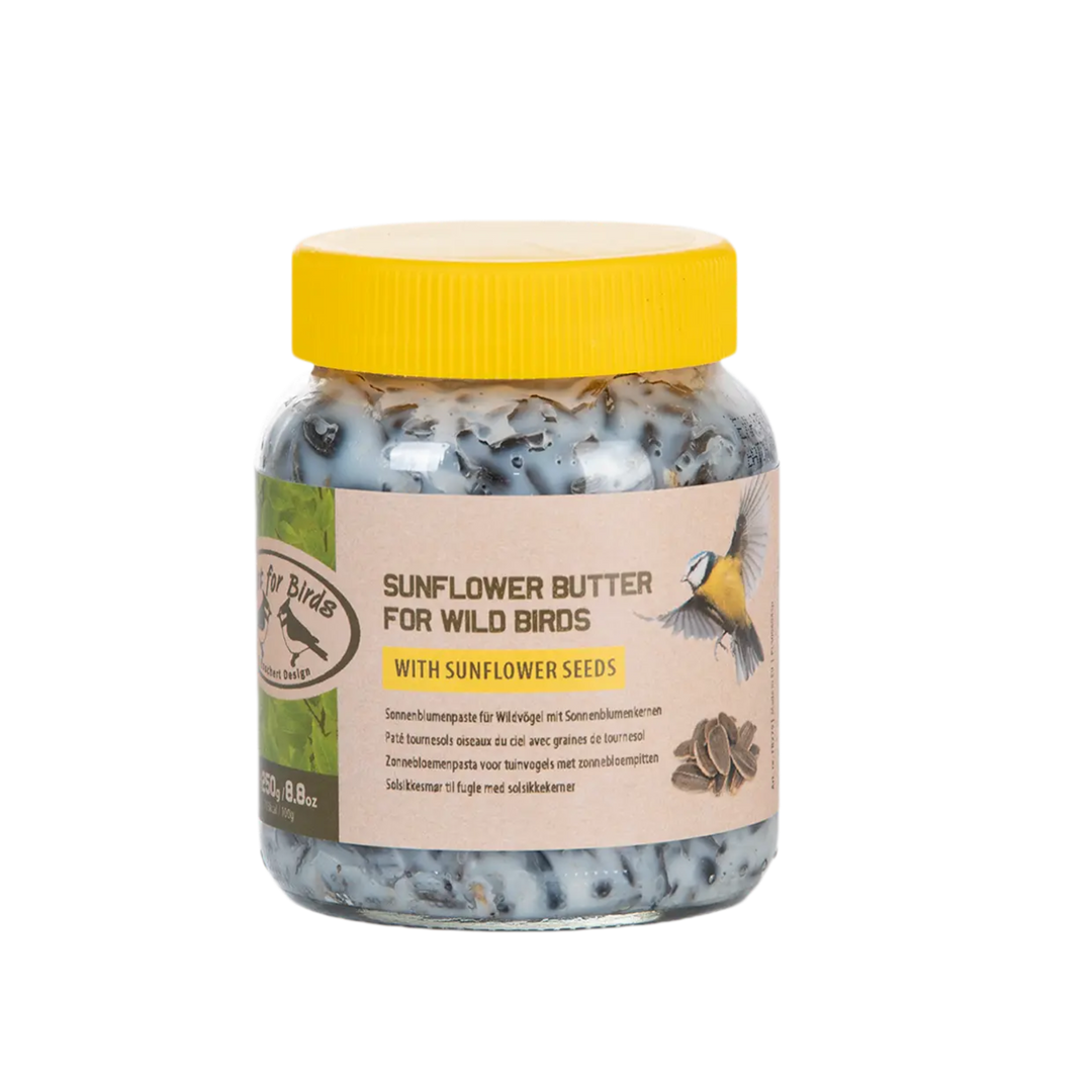 Jar of sunflower butter for wild birds with a yellow lid on a white background