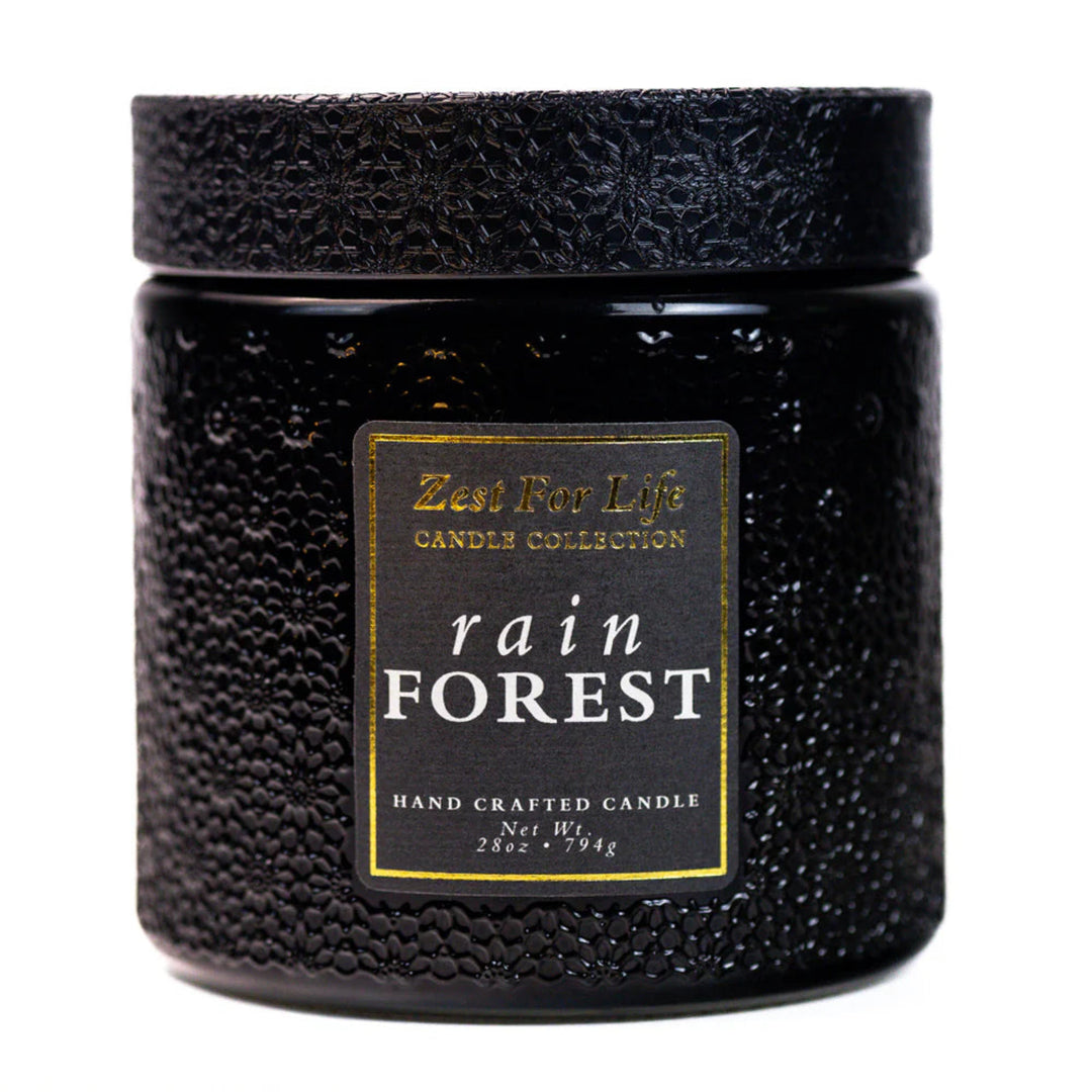 Black textured candle jar with 'Zest For Life' label on a white background