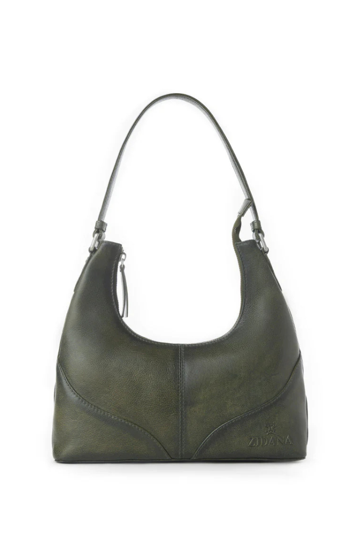 Green leather handbag on a white background