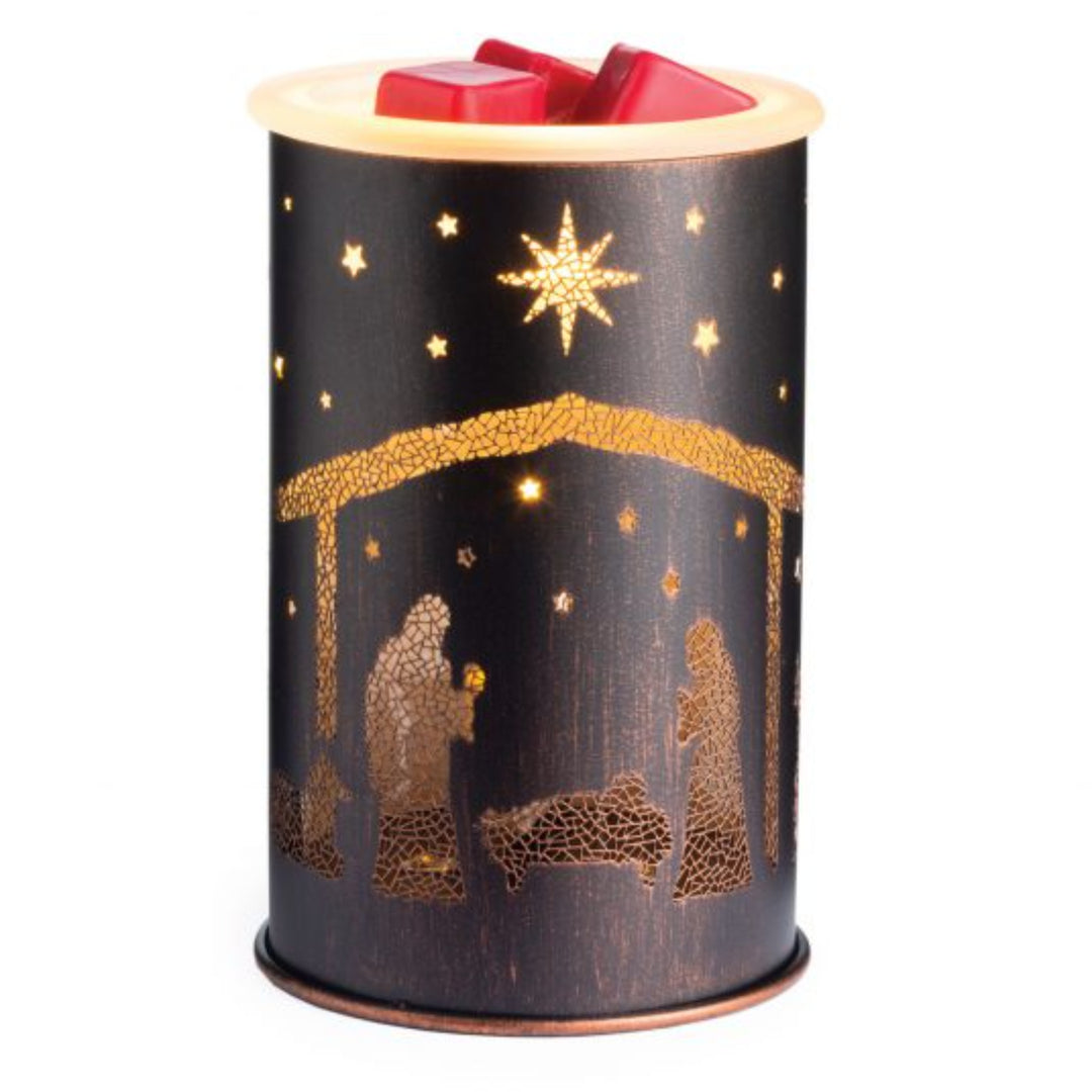 A Nativity Illumination Warmer featuring a silhouette of a nativity scene with stars on a dark background, resembling a holiday-themed electric fragrance warmer.