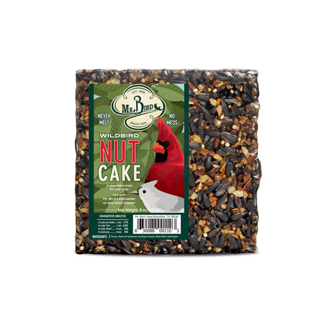 A packaged nut cake block designed for bird feeding, with a label showing an image of a red bird.